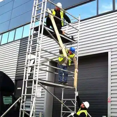 Construction workers on scaffold towers